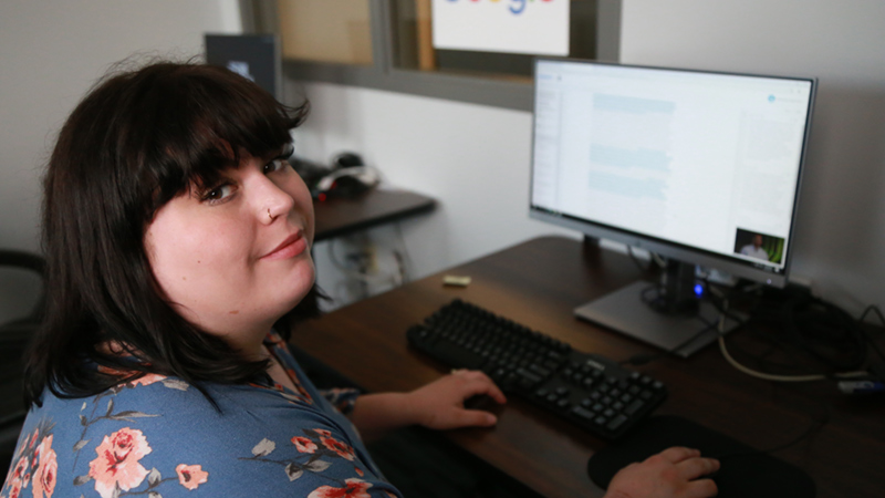 Woman working at computer.