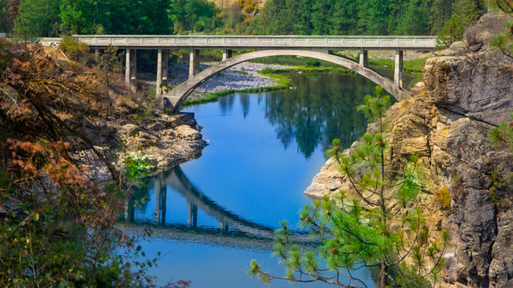 concrete arched bridge crossing Spokane river in western Idaho